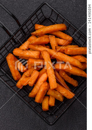 Seasoned sweet potato fries with sauce, fast food. Sweet potato fries Seasoned sweet potato fries with sauce, fast food. Sweet potato fries 141490894