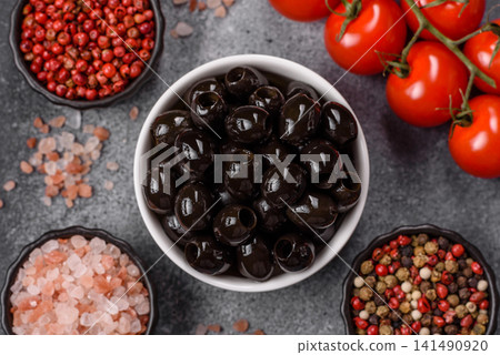Black canned olives without pits for salads and snacks. Black olives without pits Black canned olives without pits for salads and snacks. Black olives without pits 141490920