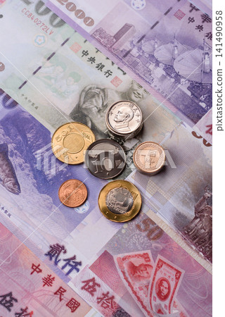 Taiwan, Taiwanese paper banknotes and coins, dollars of various denominations. Taiwanese dollars Taiwan, Taiwanese paper banknotes and coins, dollars of various denominations. Taiwanese dollars 141490958