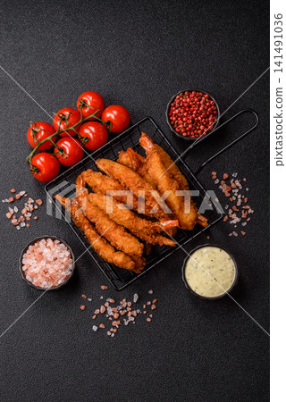 Shrimp or prawn tempura breaded with salt, spices and tartar sauce, Asian cuisine. Tempura shrimp Shrimp or prawn tempura breaded with salt, spices and tartar sauce, Asian cuisine. Tempura shrimp 141491036