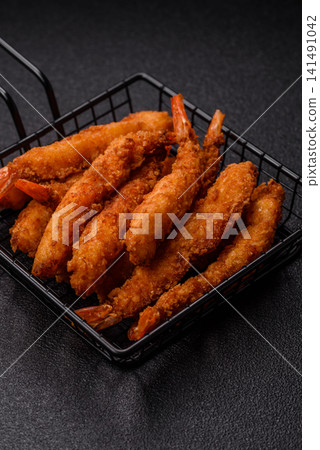 Shrimp or prawn tempura breaded with salt, spices and tartar sauce, Asian cuisine. Tempura shrimp Shrimp or prawn tempura breaded with salt, spices and tartar sauce, Asian cuisine. Tempura shrimp 141491042