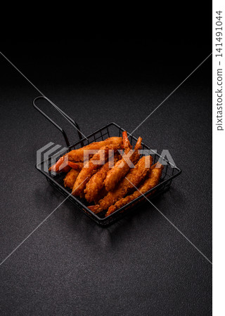 Shrimp or prawn tempura breaded with salt, spices and tartar sauce, Asian cuisine. Tempura shrimp Shrimp or prawn tempura breaded with salt, spices and tartar sauce, Asian cuisine. Tempura shrimp 141491044