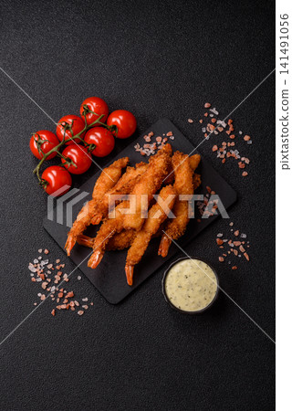 Shrimp or prawn tempura breaded with salt, spices and tartar sauce, Asian cuisine. Tempura shrimp Shrimp or prawn tempura breaded with salt, spices and tartar sauce, Asian cuisine. Tempura shrimp 141491056