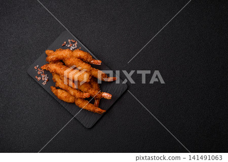 Shrimp or prawn tempura breaded with salt, spices and tartar sauce, Asian cuisine. Tempura shrimp Shrimp or prawn tempura breaded with salt, spices and tartar sauce, Asian cuisine. Tempura shrimp 141491063