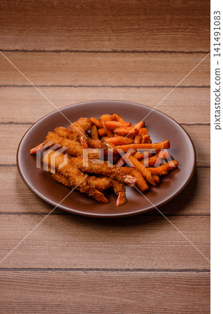 Seasoned sweet potato fries with sauce, fast food. Sweet potato fries Seasoned sweet potato fries with sauce, fast food. Sweet potato fries 141491083