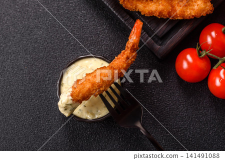Shrimp or prawn tempura breaded with salt, spices and tartar sauce, Asian cuisine. Tempura shrimp Shrimp or prawn tempura breaded with salt, spices and tartar sauce, Asian cuisine. Tempura shrimp 141491088