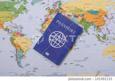 International passport against a map backdrop, concepts of travel. Passport on a map International passport against a map backdrop, concepts of travel. Passport on a map 141491133