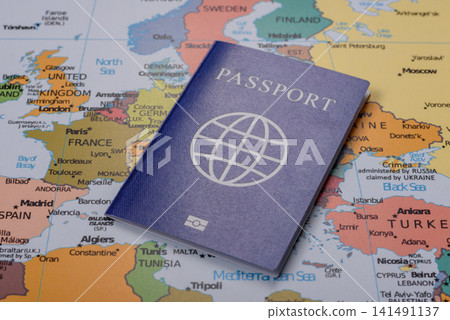 International passport against a map backdrop, concepts of travel. Passport on a map International passport against a map backdrop, concepts of travel. Passport on a map 141491137