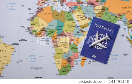 International passport against a map backdrop, concepts of travel. Passport on a map International passport against a map backdrop, concepts of travel. Passport on a map 141491148