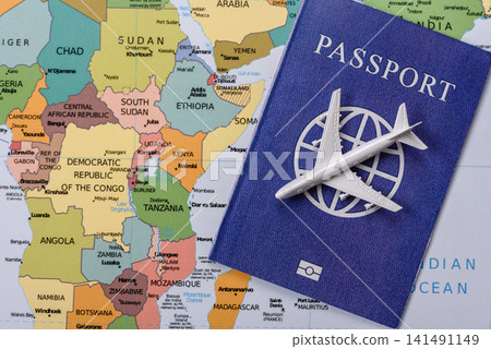 International passport against a map backdrop, concepts of travel. Passport on a map International passport against a map backdrop, concepts of travel. Passport on a map 141491149