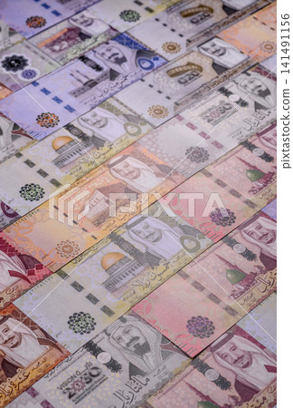 Saudi Arabia paper money, riyal banknotes and coins as currency for exchange. Saudi Arabia money Saudi Arabia paper money, riyal banknotes and coins as currency for exchange. Saudi Arabia money 141491156