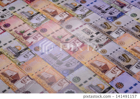 Saudi Arabia paper money, riyal banknotes and coins as currency for exchange. Saudi Arabia money Saudi Arabia paper money, riyal banknotes and coins as currency for exchange. Saudi Arabia money 141491157