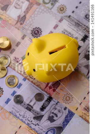 A piggy bank as a concept for storing, accumulating, and saving financial resources. A piggy bank A piggy bank as a concept for storing, accumulating, and saving financial resources. A piggy bank 141491166