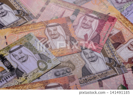 Saudi Arabia paper money, riyal banknotes and coins as currency for exchange. Saudi Arabia money Saudi Arabia paper money, riyal banknotes and coins as currency for exchange. Saudi Arabia money 141491185