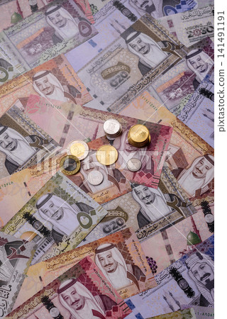 Saudi Arabia paper money, riyal banknotes and coins as currency for exchange. Saudi Arabia money Saudi Arabia paper money, riyal banknotes and coins as currency for exchange. Saudi Arabia money 141491191