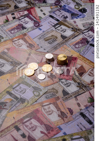 Saudi Arabia paper money, riyal banknotes and coins as currency for exchange. Saudi Arabia money Saudi Arabia paper money, riyal banknotes and coins as currency for exchange. Saudi Arabia money 141491192