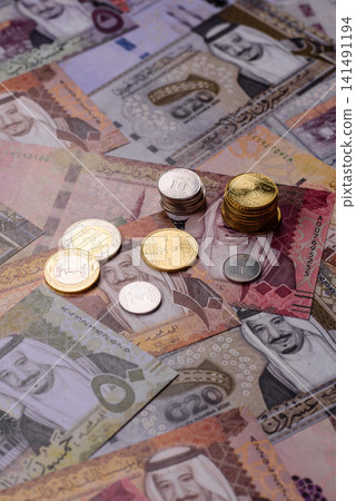 Saudi Arabia paper money, riyal banknotes and coins as currency for exchange. Saudi Arabia money Saudi Arabia paper money, riyal banknotes and coins as currency for exchange. Saudi Arabia money 141491194