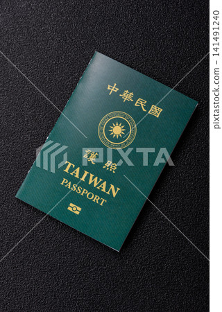 Taiwan, Taiwanese passport or id document with tickets for flight, travel. Taiwanese passport Taiwan, Taiwanese passport or id document with tickets for flight, travel. Taiwanese passport 141491240