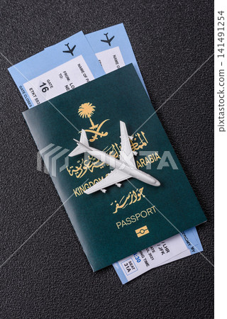 Saudi Arabia passport or id document with tickets for flight, travel. Saudi Arabia passport Saudi Arabia passport or id document with tickets for flight, travel. Saudi Arabia passport 141491254