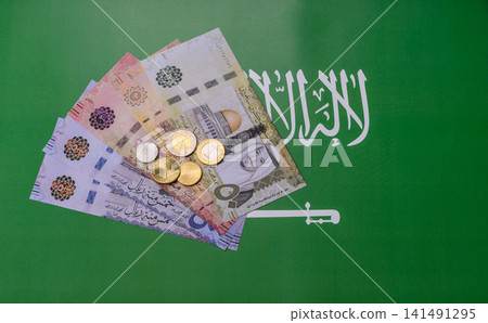 Saudi Arabia paper money, riyal banknotes and coins as currency for exchange. Saudi Arabia money Saudi Arabia paper money, riyal banknotes and coins as currency for exchange. Saudi Arabia money 141491295