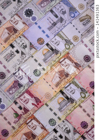 Saudi Arabia paper money, riyal banknotes and coins as currency for exchange. Saudi Arabia money Saudi Arabia paper money, riyal banknotes and coins as currency for exchange. Saudi Arabia money 141491363