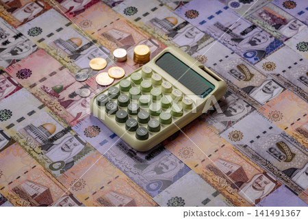 Saudi Arabia paper money, riyal banknotes and coins as currency for exchange. Saudi Arabia money Saudi Arabia paper money, riyal banknotes and coins as currency for exchange. Saudi Arabia money 141491367