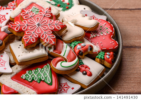Gingerbread as a Christmas staple, sweet biscuits for the holiday table. Gingerbread as a backdrop Gingerbread as a Christmas staple, sweet biscuits for the holiday table. Gingerbread as a backdrop 141491430
