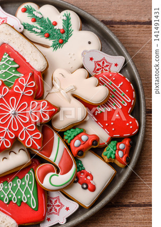 Gingerbread as a Christmas staple, sweet biscuits for the holiday table. Gingerbread as a backdrop Gingerbread as a Christmas staple, sweet biscuits for the holiday table. Gingerbread as a backdrop 141491431