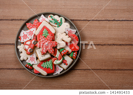 Gingerbread as a Christmas staple, sweet biscuits for the holiday table. Gingerbread as a backdrop Gingerbread as a Christmas staple, sweet biscuits for the holiday table. Gingerbread as a backdrop 141491433