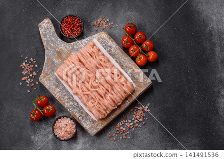 Fresh raw ground chicken, poultry meat for home cooking. Ground chicken Fresh raw ground chicken, poultry meat for home cooking. Ground chicken 141491536