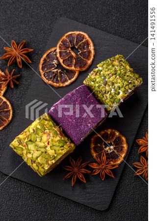 Turkish delight or lokum is a traditional Eastern sweet made with nuts. Turkish delight, lokum Turkish delight or lokum is a traditional Eastern sweet made with nuts. Turkish delight, lokum 141491556