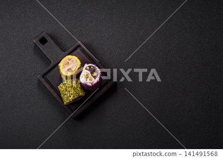 Turkish delight or lokum is a traditional Eastern sweet made with nuts. Turkish delight, lokum Turkish delight or lokum is a traditional Eastern sweet made with nuts. Turkish delight, lokum 141491568