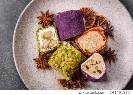 Turkish delight or lokum is a traditional Eastern sweet made with nuts. Turkish delight, lokum Turkish delight or lokum is a traditional Eastern sweet made with nuts. Turkish delight, lokum 141491573