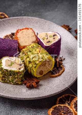 Turkish delight or lokum is a traditional Eastern sweet made with nuts. Turkish delight, lokum Turkish delight or lokum is a traditional Eastern sweet made with nuts. Turkish delight, lokum 141491576