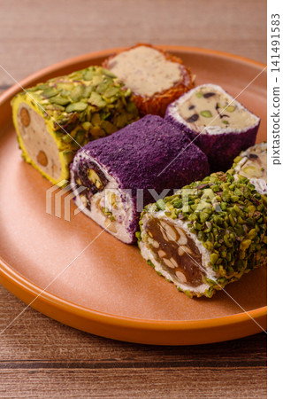Turkish delight or lokum is a traditional Eastern sweet made with nuts. Turkish delight, lokum Turkish delight or lokum is a traditional Eastern sweet made with nuts. Turkish delight, lokum 141491583