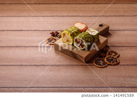 Turkish delight or lokum is a traditional Eastern sweet made with nuts. Turkish delight, lokum Turkish delight or lokum is a traditional Eastern sweet made with nuts. Turkish delight, lokum 141491589