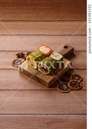 Turkish delight or lokum is a traditional Eastern sweet made with nuts. Turkish delight, lokum Turkish delight or lokum is a traditional Eastern sweet made with nuts. Turkish delight, lokum 141491591