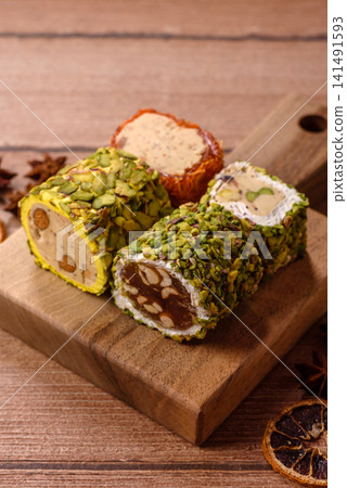 Turkish delight or lokum is a traditional Eastern sweet made with nuts. Turkish delight, lokum Turkish delight or lokum is a traditional Eastern sweet made with nuts. Turkish delight, lokum 141491593