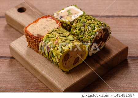Turkish delight or lokum is a traditional Eastern sweet made with nuts. Turkish delight, lokum Turkish delight or lokum is a traditional Eastern sweet made with nuts. Turkish delight, lokum 141491594
