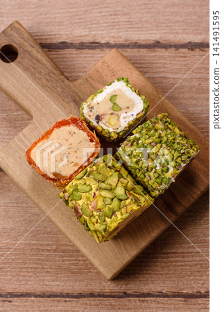 Turkish delight or lokum is a traditional Eastern sweet made with nuts. Turkish delight, lokum Turkish delight or lokum is a traditional Eastern sweet made with nuts. Turkish delight, lokum 141491595