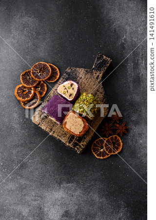 Turkish delight or lokum is a traditional Eastern sweet made with nuts. Turkish delight, lokum Turkish delight or lokum is a traditional Eastern sweet made with nuts. Turkish delight, lokum 141491610