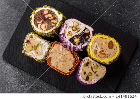 Turkish delight or lokum is a traditional Eastern sweet made with nuts. Turkish delight, lokum Turkish delight or lokum is a traditional Eastern sweet made with nuts. Turkish delight, lokum 141491624