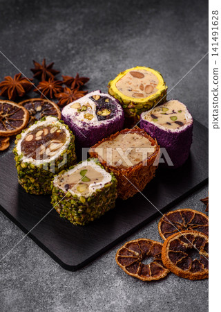 Turkish delight or lokum is a traditional Eastern sweet made with nuts. Turkish delight, lokum Turkish delight or lokum is a traditional Eastern sweet made with nuts. Turkish delight, lokum 141491628