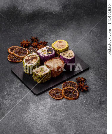 Turkish delight or lokum is a traditional Eastern sweet made with nuts. Turkish delight, lokum Turkish delight or lokum is a traditional Eastern sweet made with nuts. Turkish delight, lokum 141491630