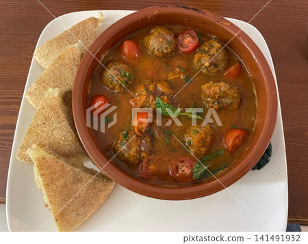 Traditional Moroccan Kefta Meatball Tajine with Fresh Tomatoes and Bread Traditional Moroccan Kefta Meatball Tajine with Fresh Tomatoes and Bread 141491932