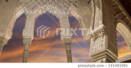Arches in Islamic (Moorish) style (against the sunset) in Alhambra, Granada, Spain Arches in Islamic (Moorish) style (against the sunset) in Alhambra, Granada, Spain 141491991
