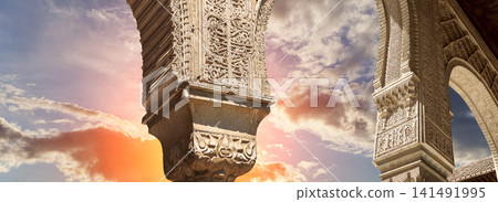 Arches in Islamic (Moorish) style (against the sunset) in Alhambra, Granada, Spain Arches in Islamic (Moorish) style (against the sunset) in Alhambra, Granada, Spain 141491995