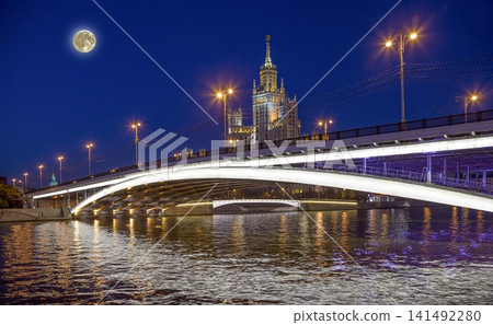 Bolshoy Ustinsky Bridge (with the super moon), Moscow, Russia-- is a steel arch bridge that spans Moskva River near the mouth of Yauza River, connecting the Boulevard Ring with Zamoskvorechye district Bolshoy Ustinsky Bridge (with the super moon), Moscow, Russia-- is a steel arch bridge that spans Moskva River near the mouth of Yauza River, connecting the Boulevard Ring with Zamoskvorechye district 141492280