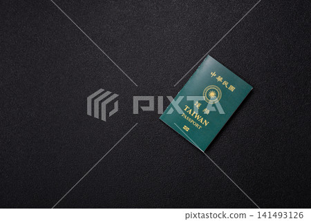 Taiwan, Taiwanese passport or id document with tickets for flight, travel. Taiwanese passport Taiwan, Taiwanese passport or id document with tickets for flight, travel. Taiwanese passport 141493126