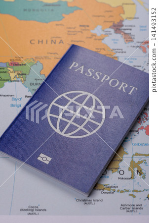 International passport against a map backdrop, concepts of travel. Passport on a map International passport against a map backdrop, concepts of travel. Passport on a map 141493152